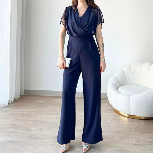 シフォン袖とドレープデザインが上品なネイビーの夏パンツドレス 正面全身