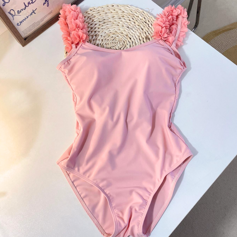 平置きでわかる淡いピンクの立体感フリルワンピース水着