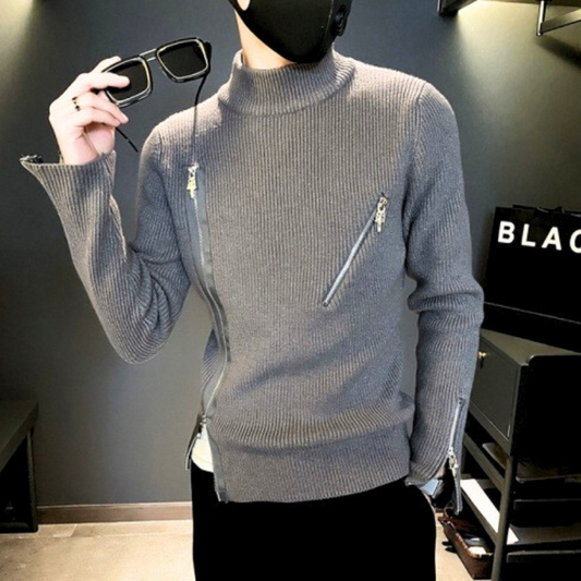 サングラスを持った男性モデルとグレーニットの組み合わせ