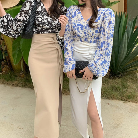 ベージュ、ホワイトの2色スカートを着た女性が並んだ写真。シーンやコーデに合わせて選べるカラーバリエーション