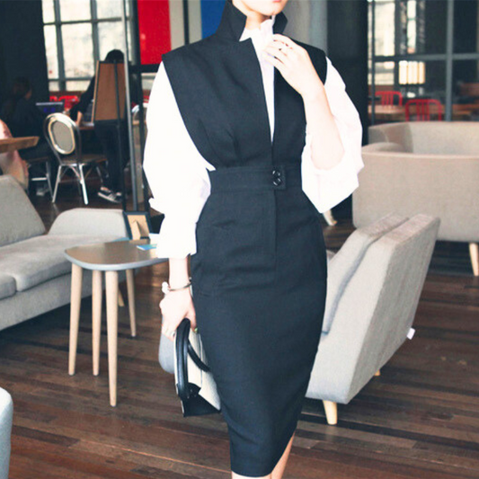 バッグを持ち歩く黒のジャンパースカートスタイルの女性