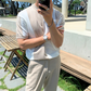 腕時計を合わせた涼しげなストライプニット夏コーデ