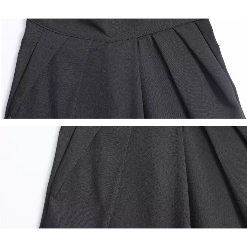 タックが深く入ったワイドパンツの生地感アップ。落ち感があり大人の女性に似合う黒パン。