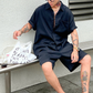 涼感×上品さを両立したブラック サマーセットアップ オープンカラーシャツ×ショートパンツ 30代メンズ向け