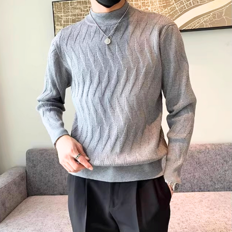 ダークグレーの波打ち柄ニットが落ち着いた雰囲気を演出。大人の秋コーデにおすすめ