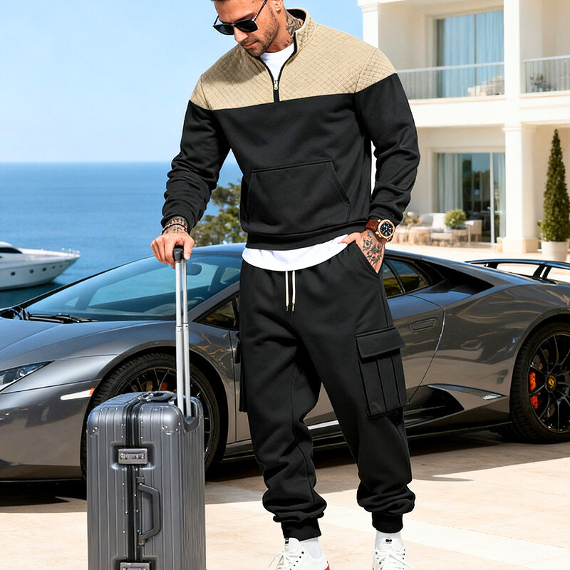 ブラック×ベージュの配色キルティングスウェットを着た男性｜春秋冬の大人モノトーンコーデ